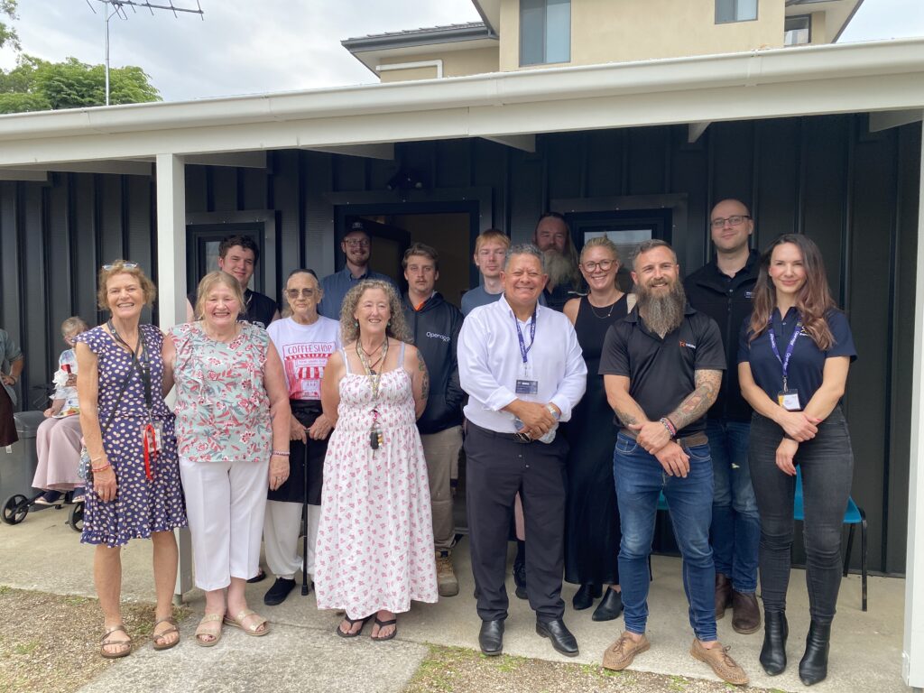 CHL Ferntree Gully residents, team members and the team from Opendoor standing outside in front of the new community space.