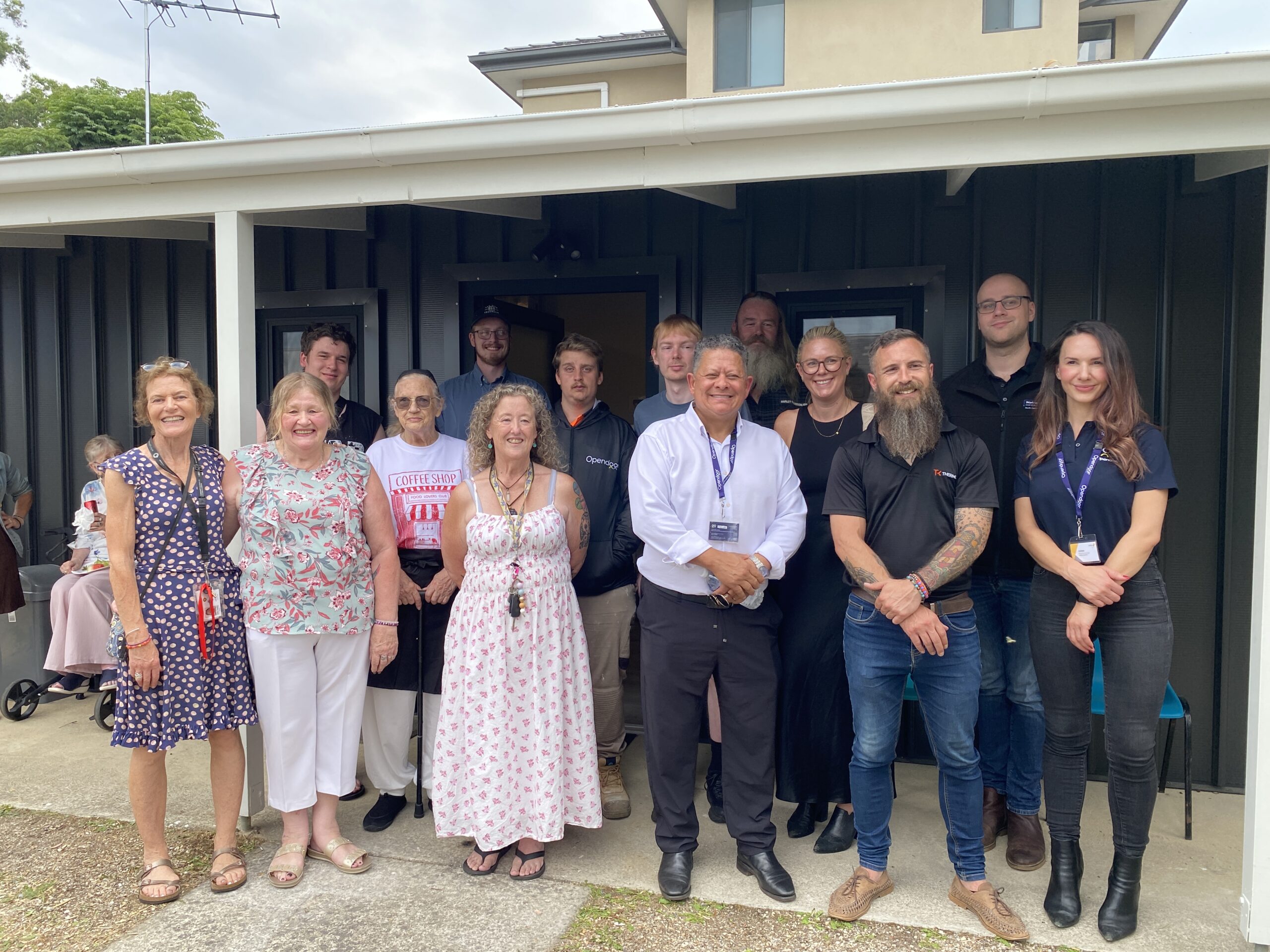 CHL Ferntree Gully residents, team members and the team from Opendoor standing outside in front of the new community space.